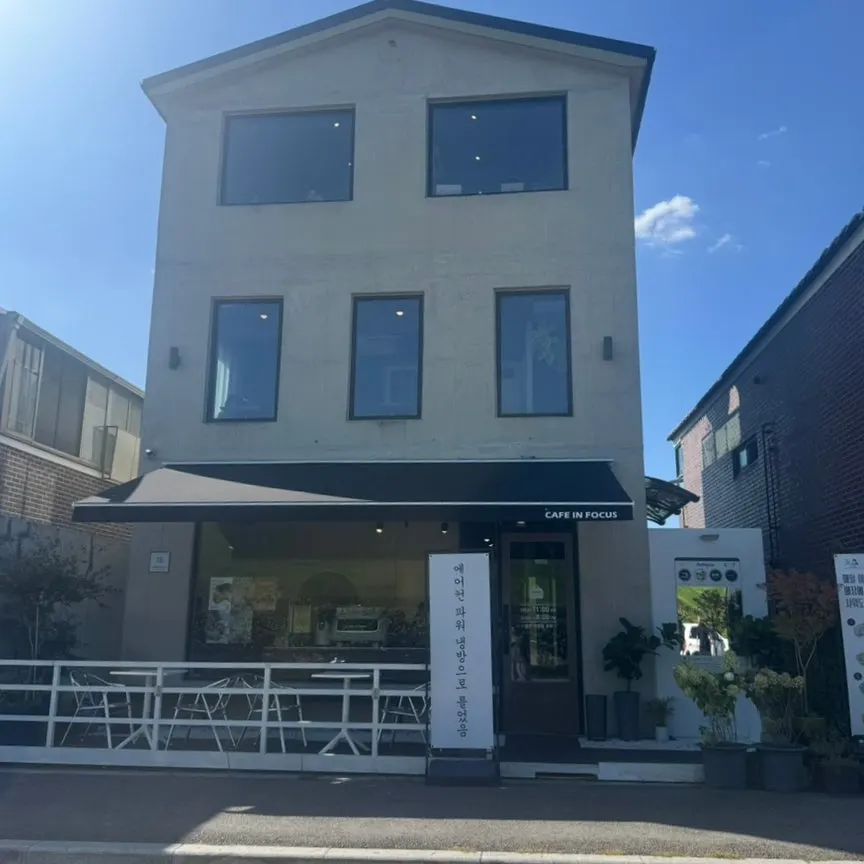 Standalone three-story exterior of Caffeine Focus in Haenggung-dong, Suwon