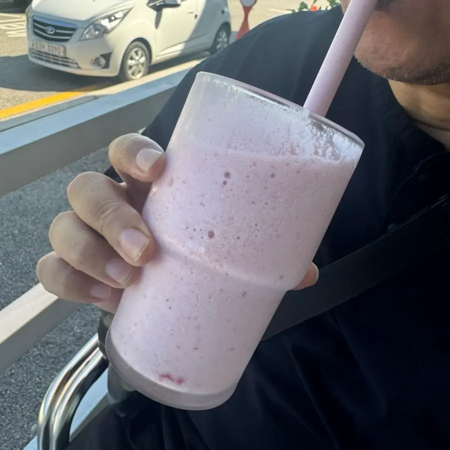 Pastel pink strawberry yogurt smoothie