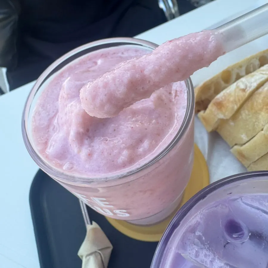 Close-up of the strawberry yogurt smoothie on the outdoor table