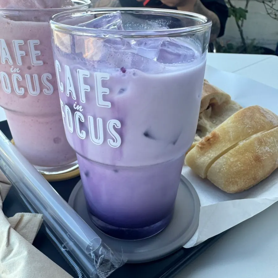Strawberry yogurt smoothie at an outdoor seat with a fortress view