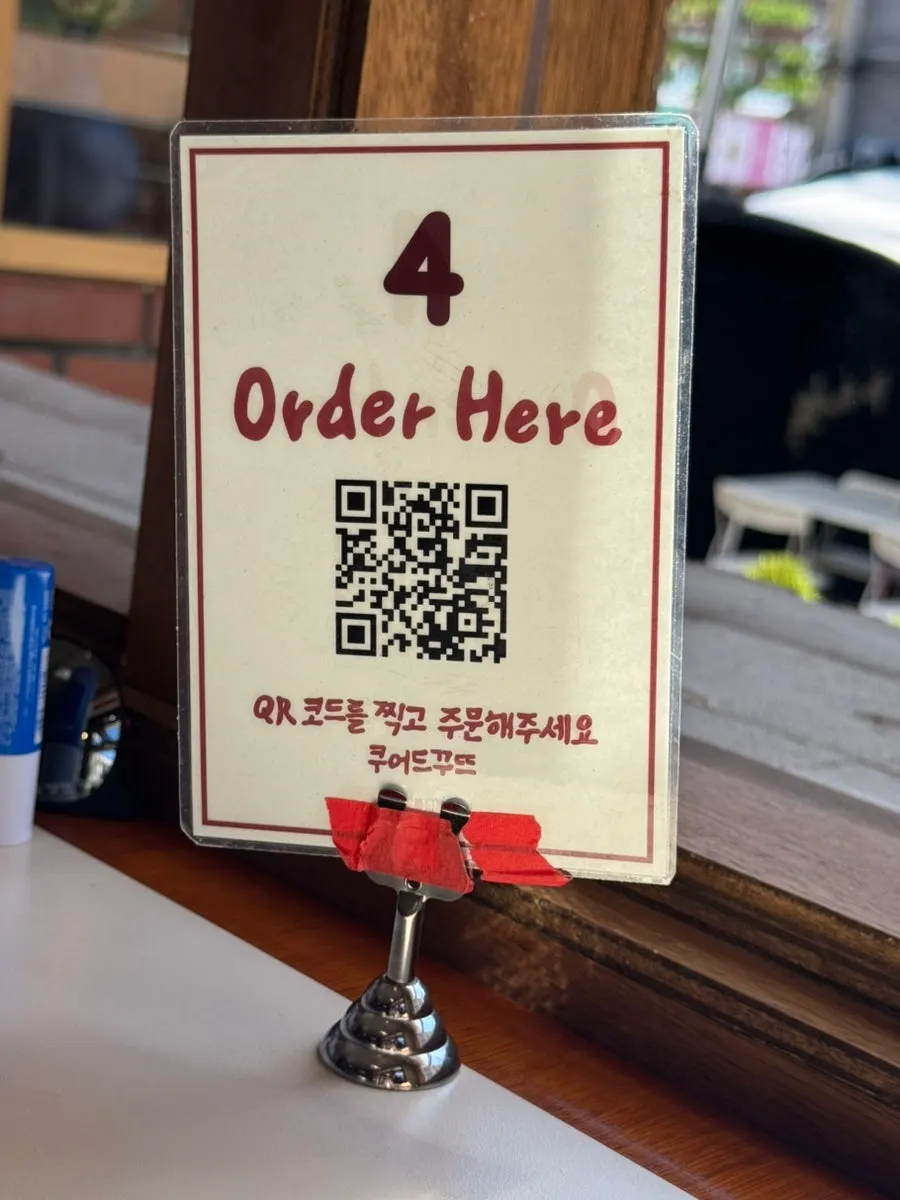 Numbered QR code ordering sign on the table