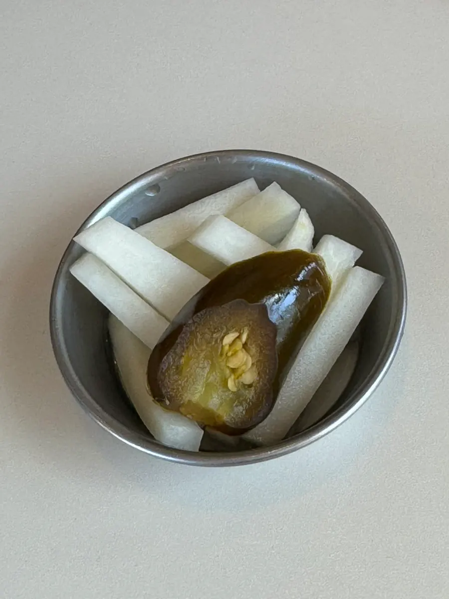 Plate of radish pickle and jalapeño