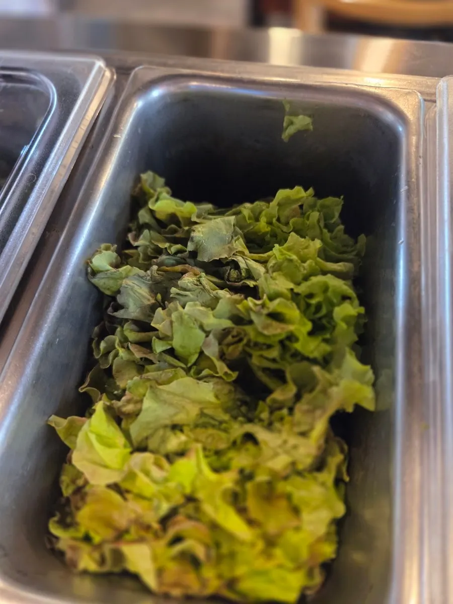 Lettuce and peppers at the self-serve bar