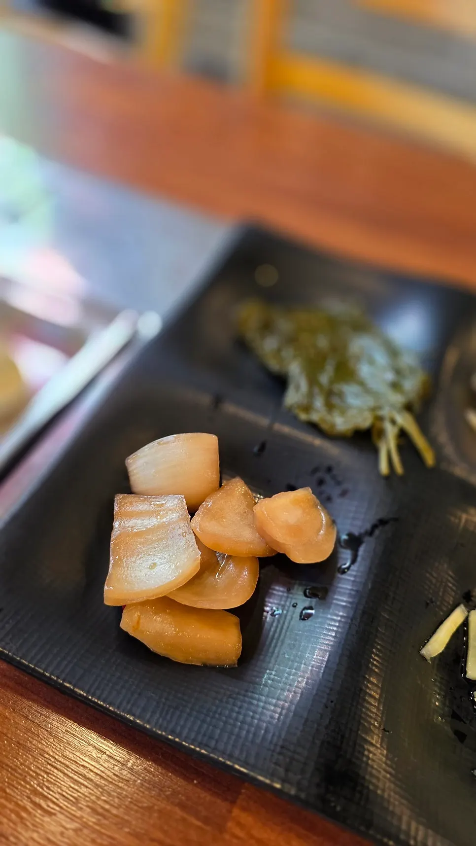 Picking up a fully cooked piece of eel