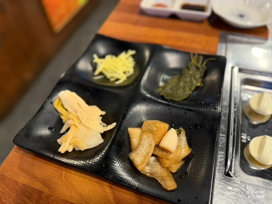 A plate of basic side dishes gathered from the self-serve bar