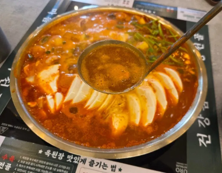 Soft tofu hot pot cooking with eggs