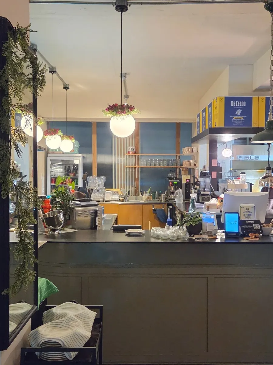 View of the restaurant with the open kitchen visible in the center