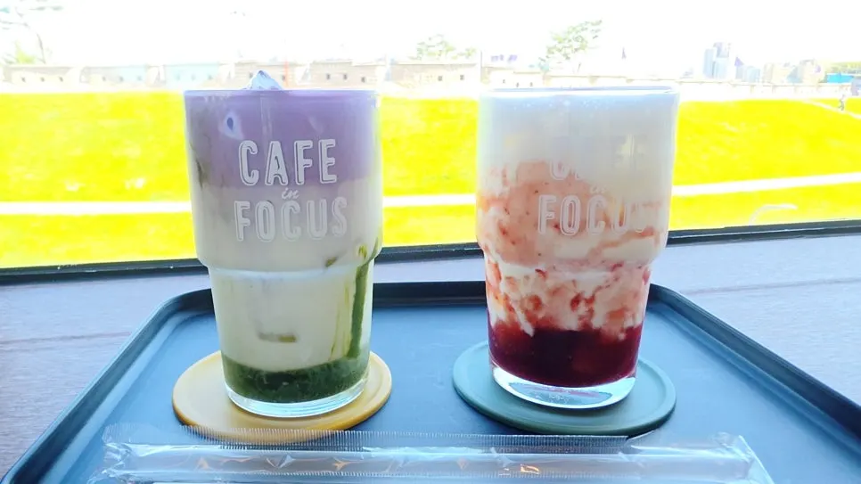 Two drinks: ube cream matcha latte and strawberry latte