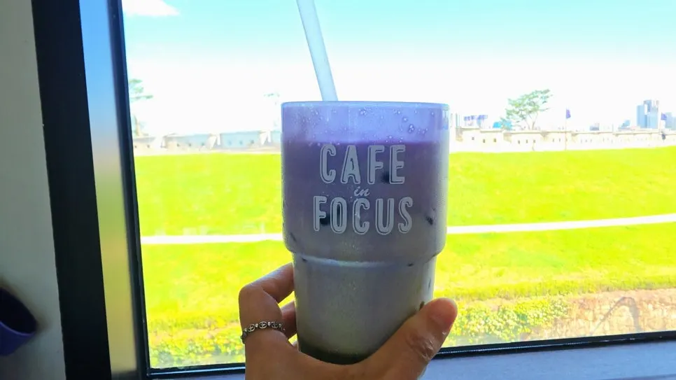 Cold drinks by the window with Hwaseong Fortress in the background