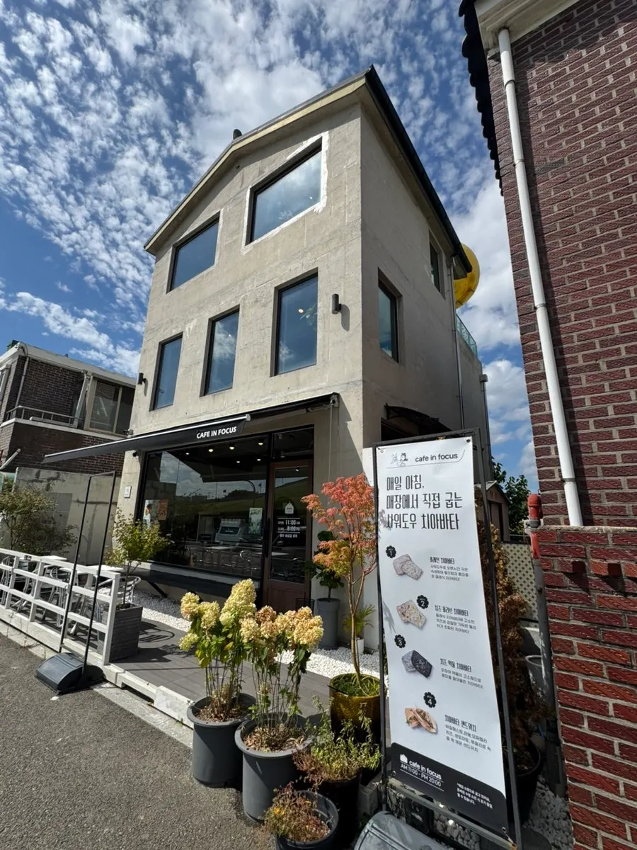 Café entrance with a sign noting ciabatta baked fresh every morning