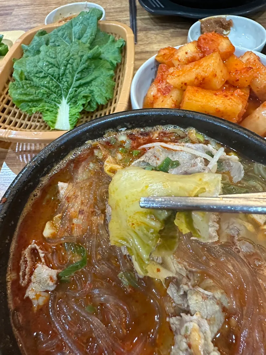 Stone pot of hangover soup with napa cabbage and glass noodles