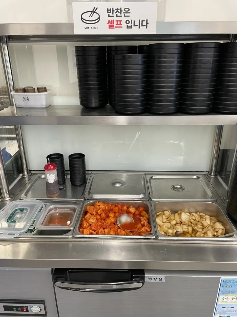 Self-serve bar with kimchi and diced radish kimchi