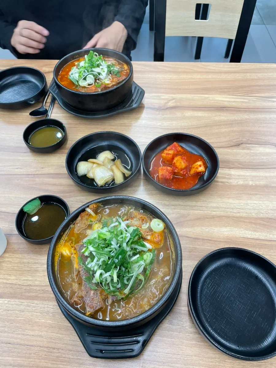 Table set with soup and side dishes taken from the self-serve bar
