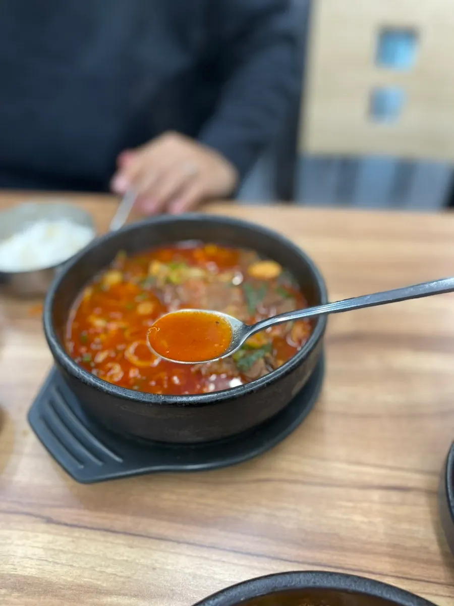 Spicy pork bone soup broth with visible heat