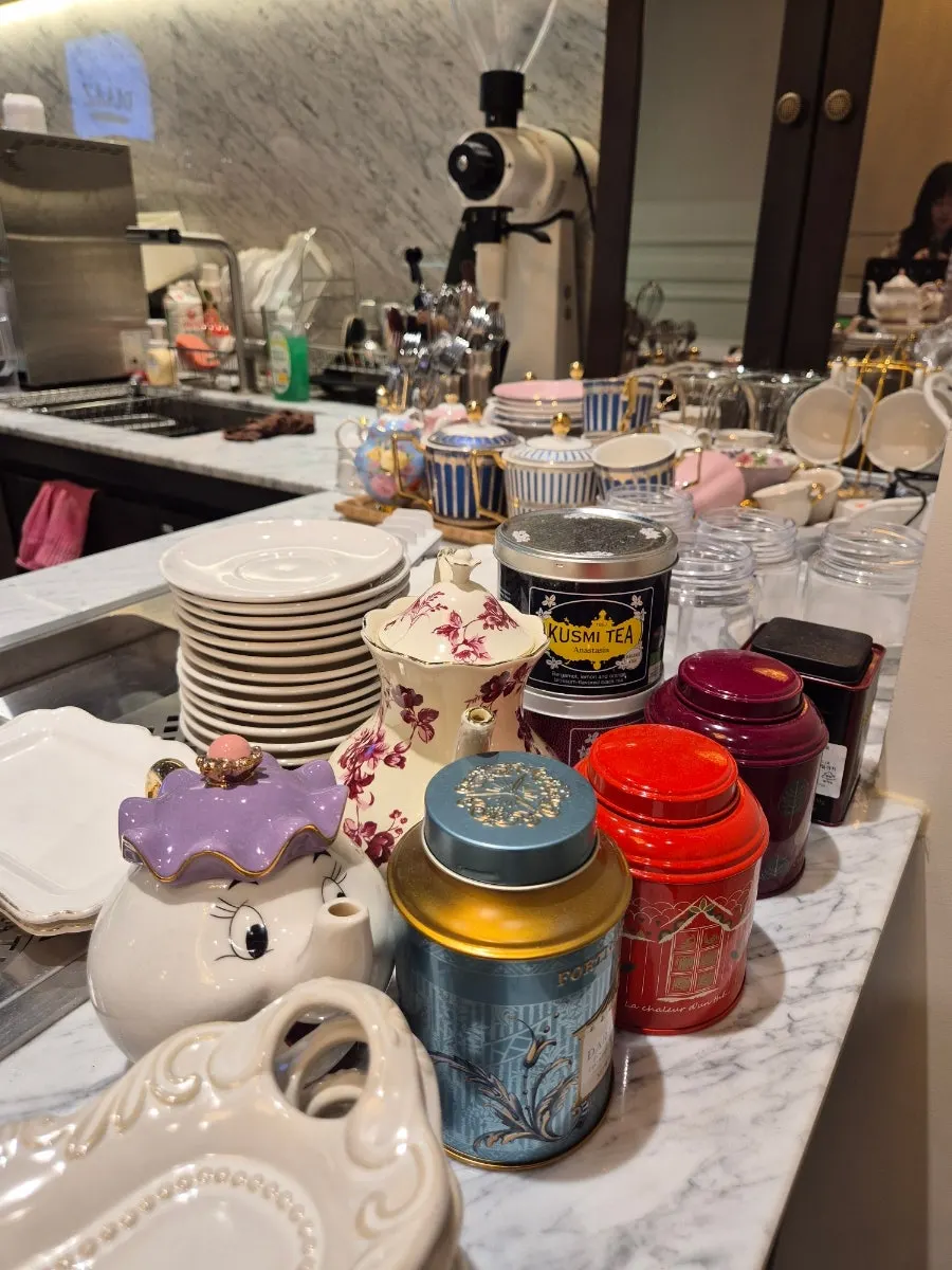 Teacup and teapot sets displayed on the wall