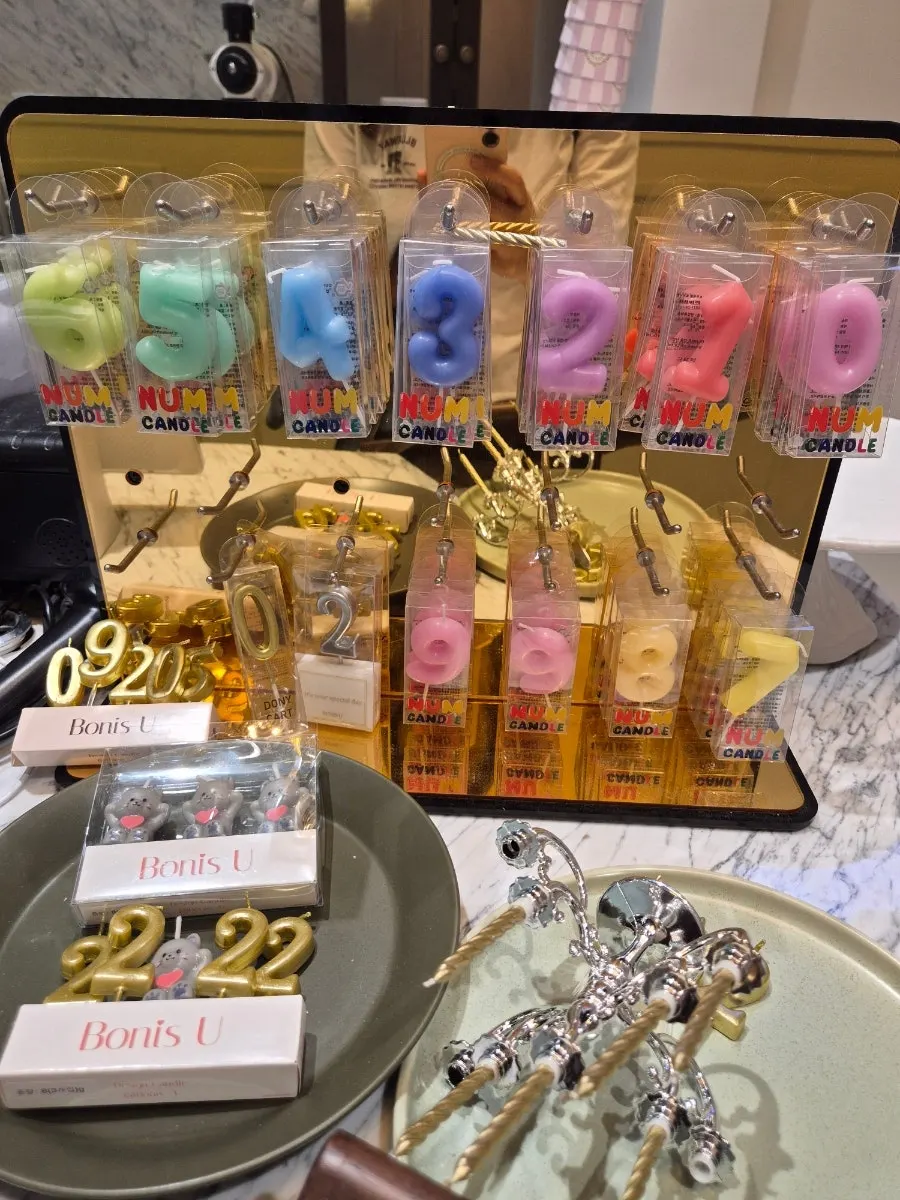 Candles and party decorations displayed atop the showcase