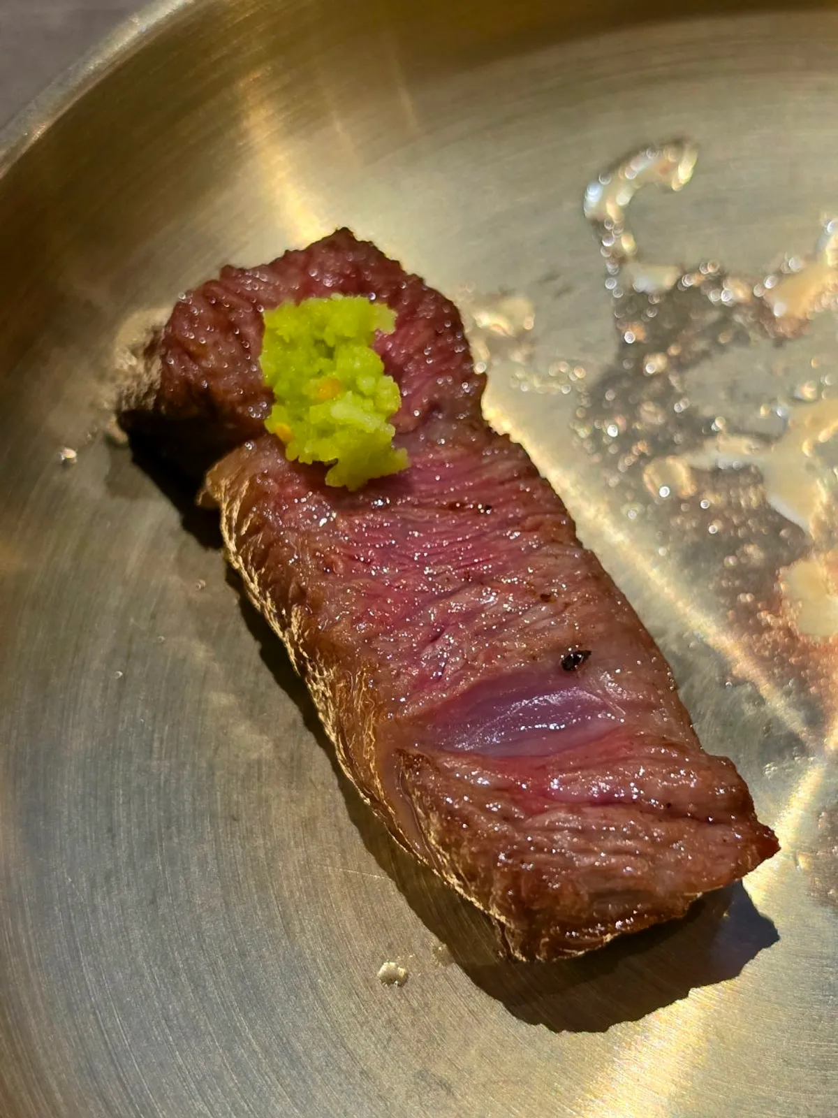 A piece of hanwoo sirloin dipped in salt