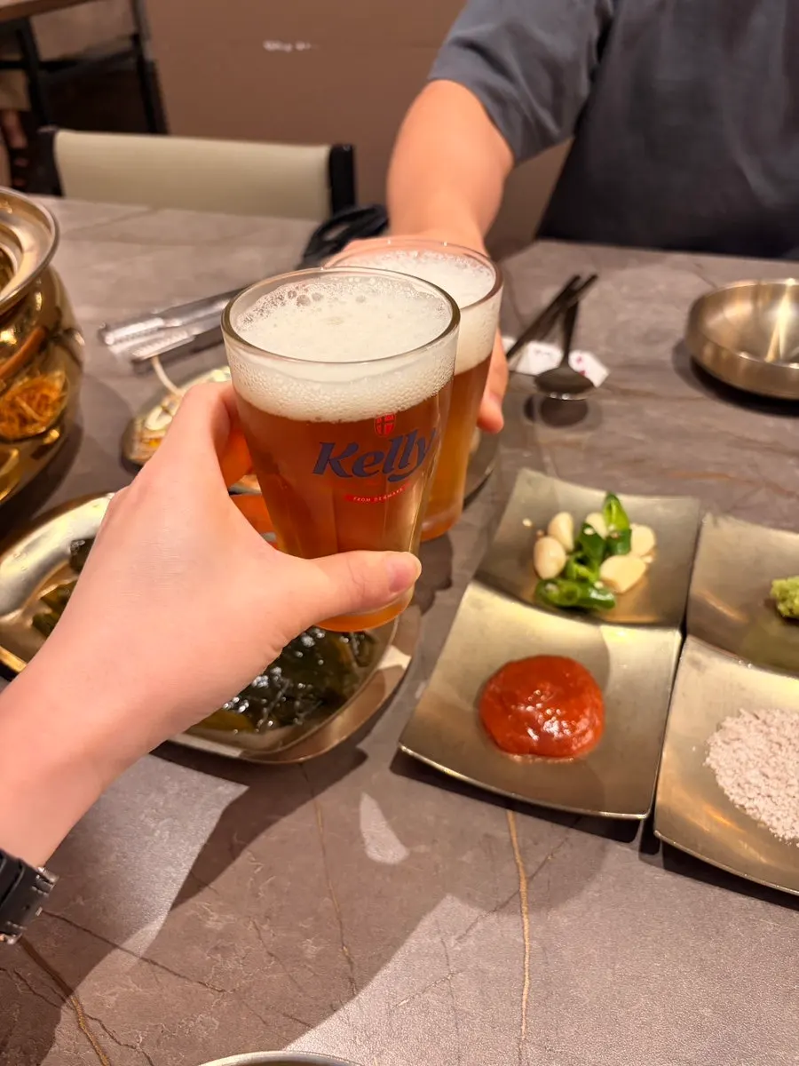 A glass of non-alcoholic beer before the meat arrives