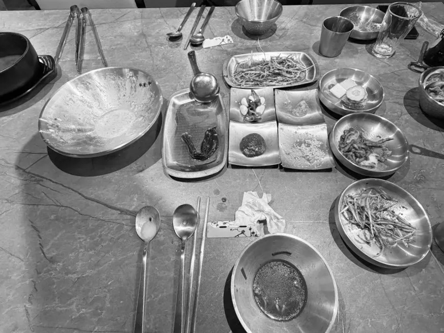 Table cleared of meat, ramyeon, and bingsu