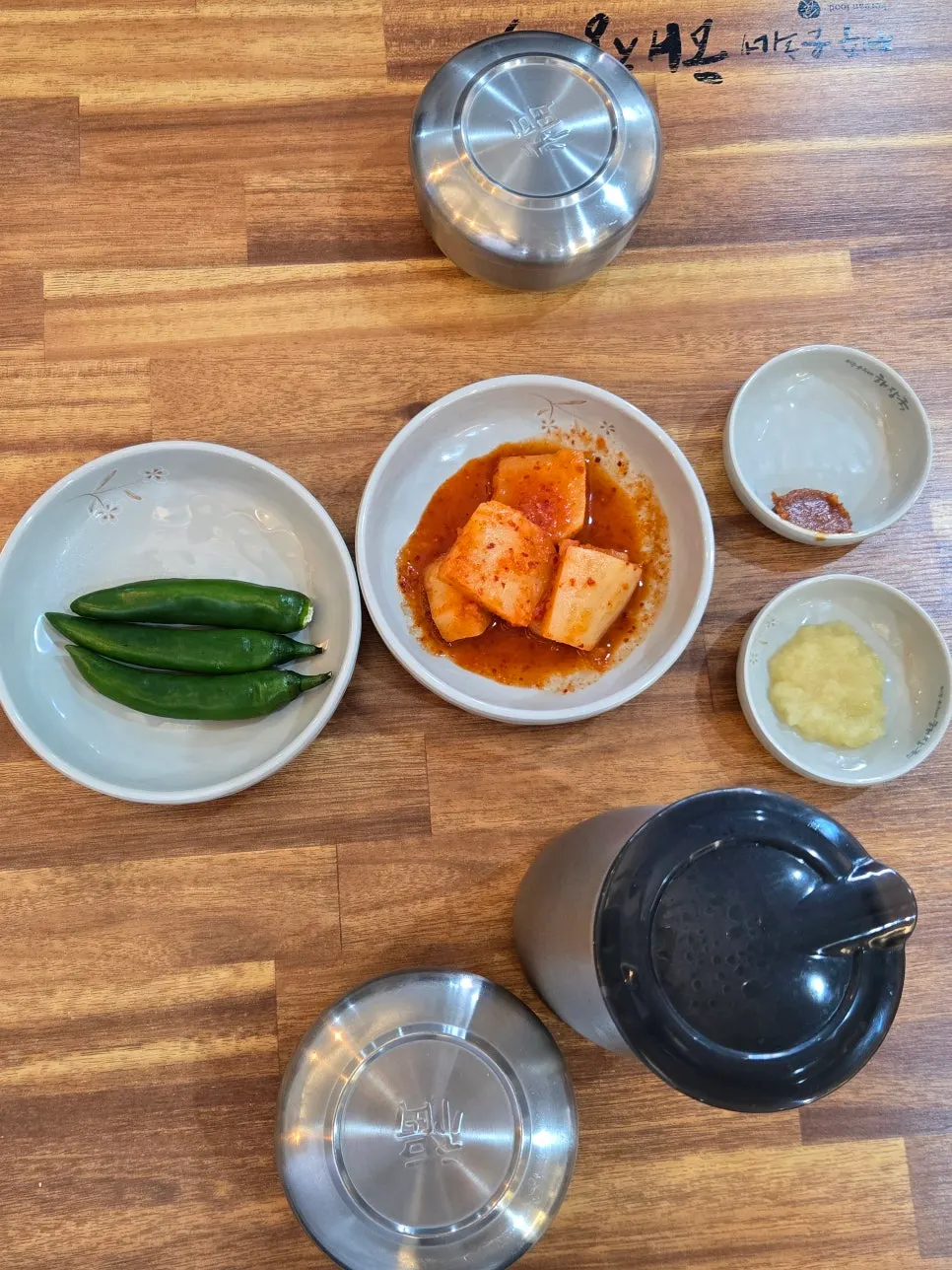 Basic side dishes with diced radish kimchi, minced garlic, and ssamjang