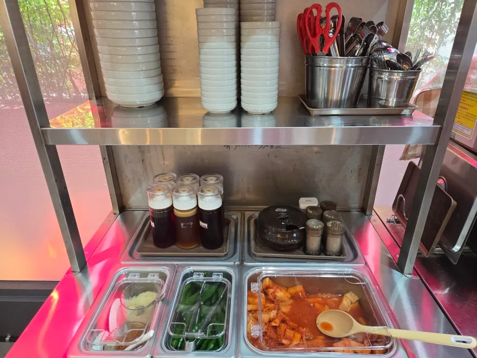 Self-serve shelf stocked with side dishes and seasonings