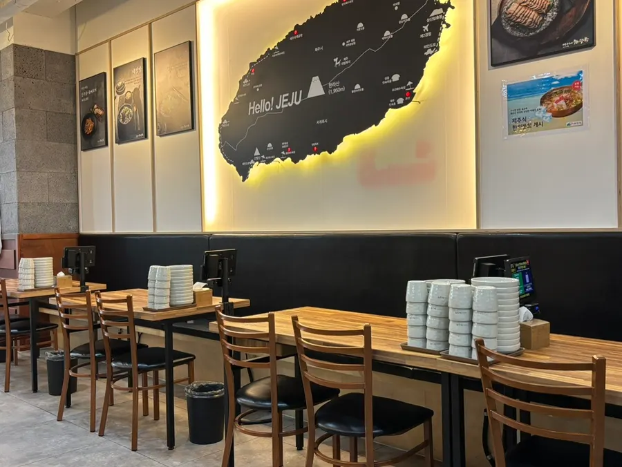 Empty tables and a branch map before customers arrived