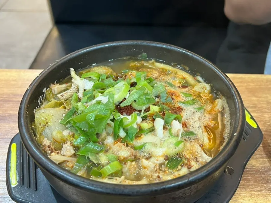 A bowl of naejangtang packed with ingredients