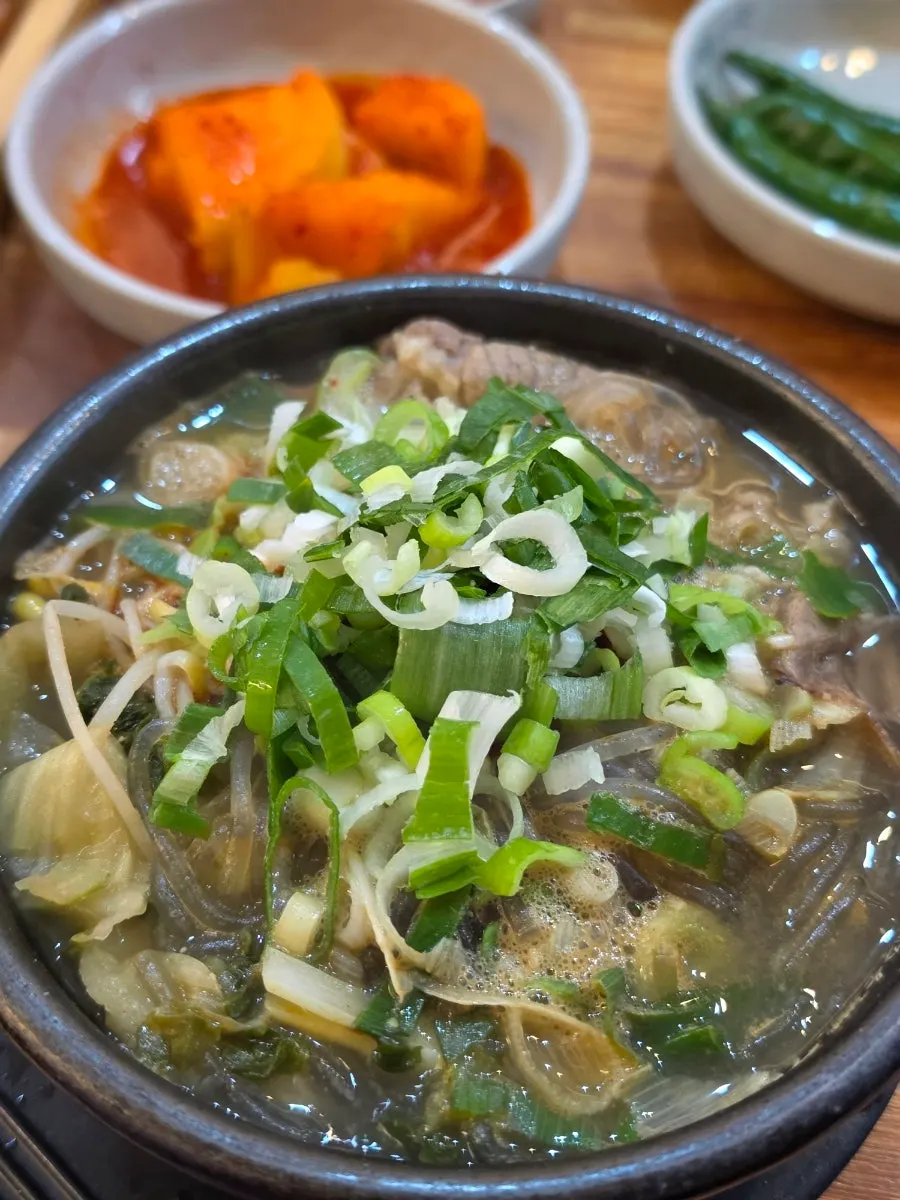 A bowl of haejangguk piled high with scallions