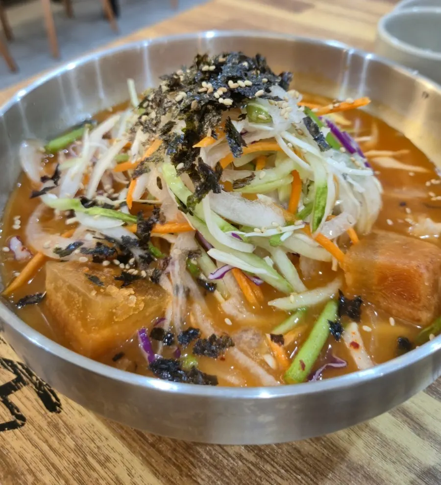 A bowl of mulhoe with squid and vegetables