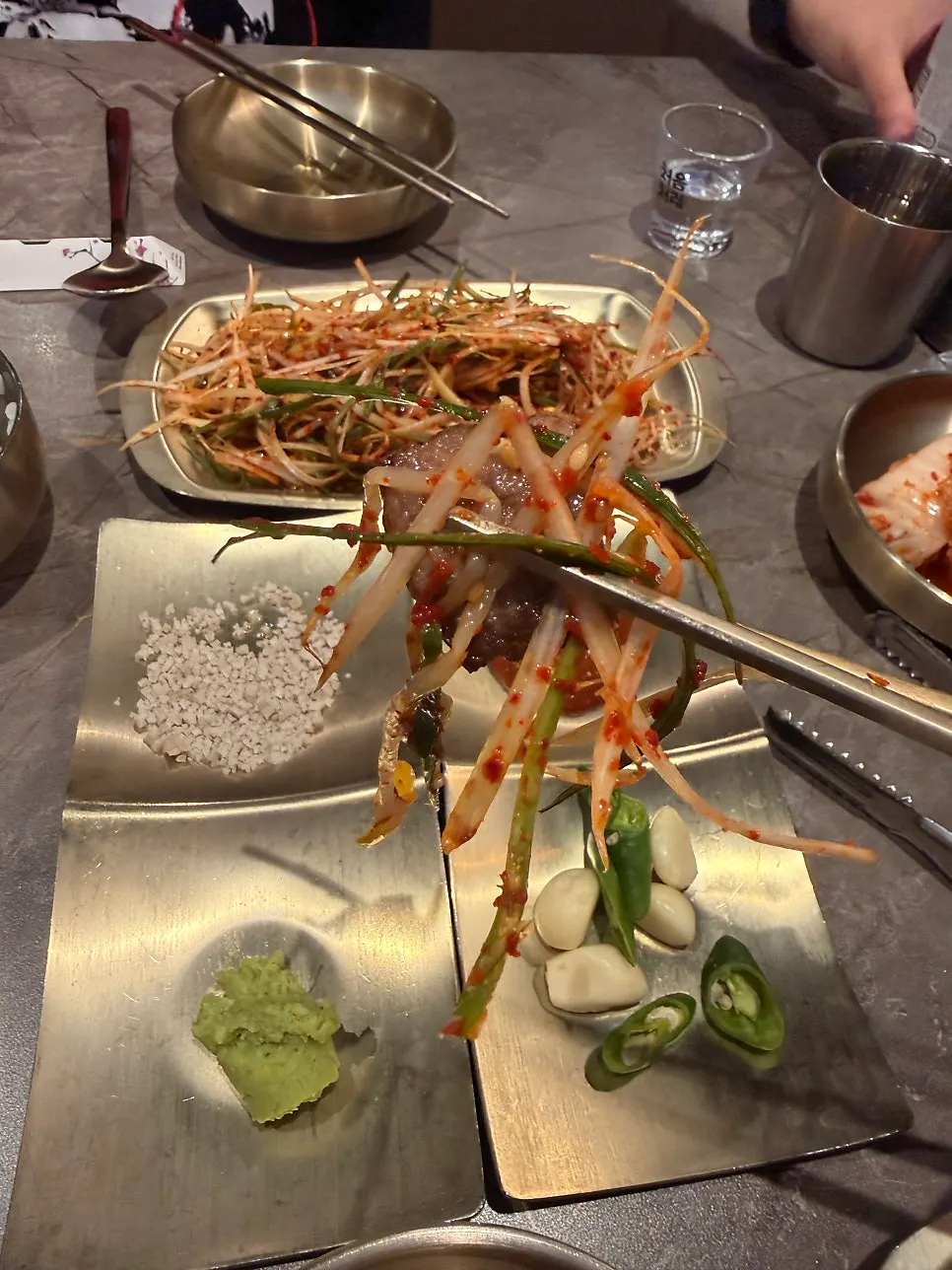 Basic side dishes including roasted salt, fresh wasabi, and myeong-i namul