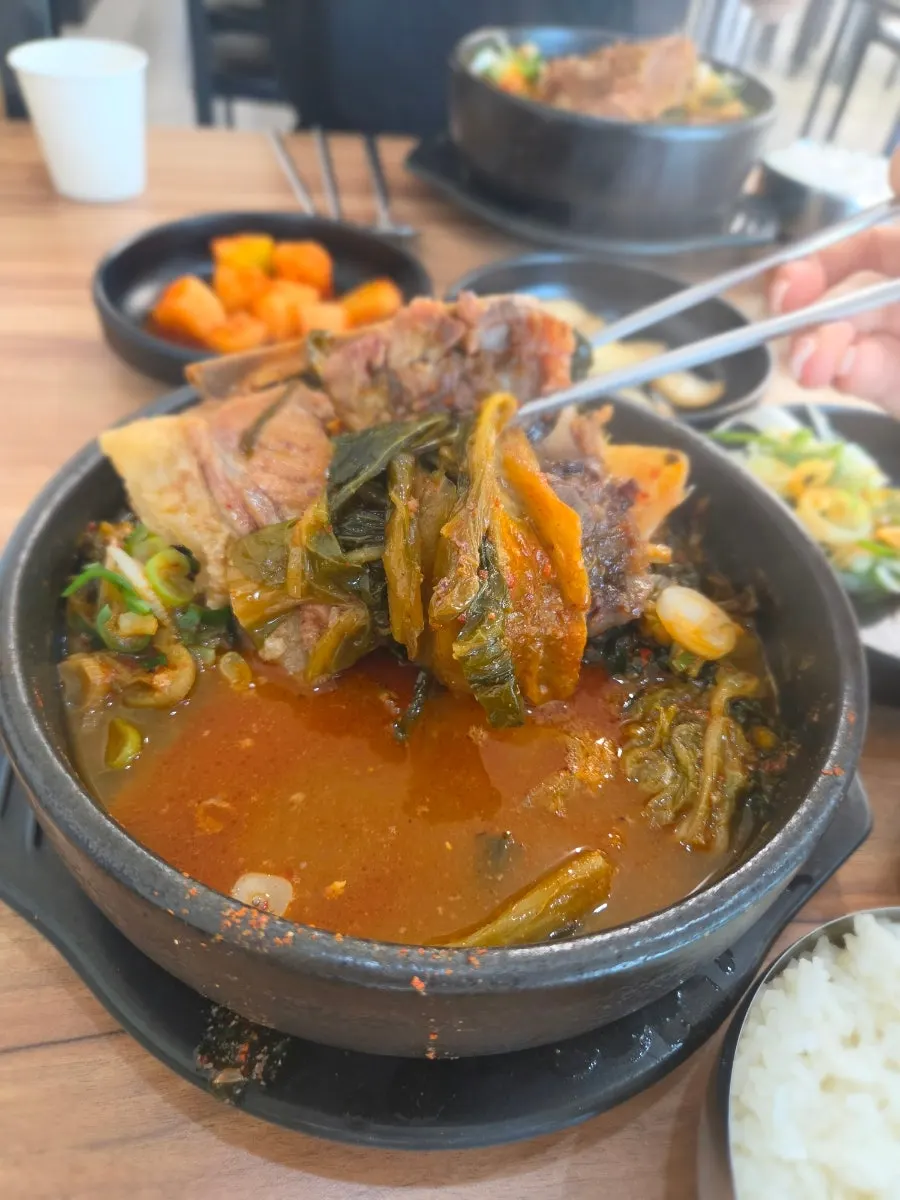 Meat picked off the bone with spicy broth