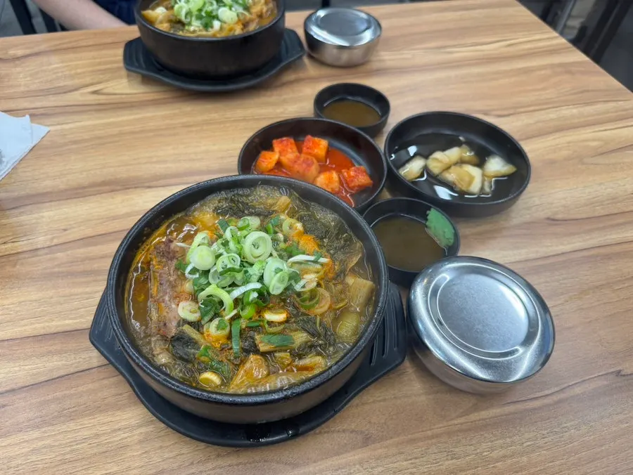 Two bowls of boiling ugeoji special pork bone soup