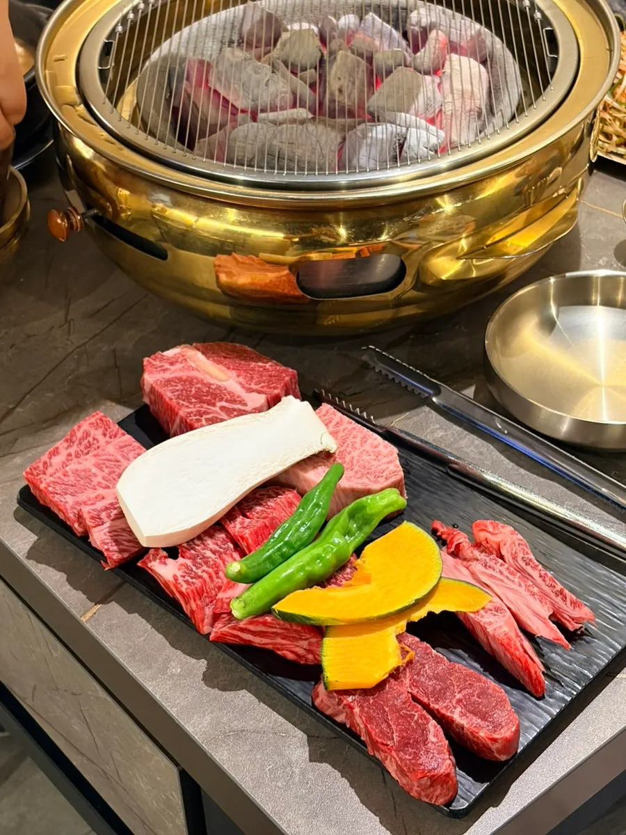 Hanwoo assorted cuts placed on the charcoal grill