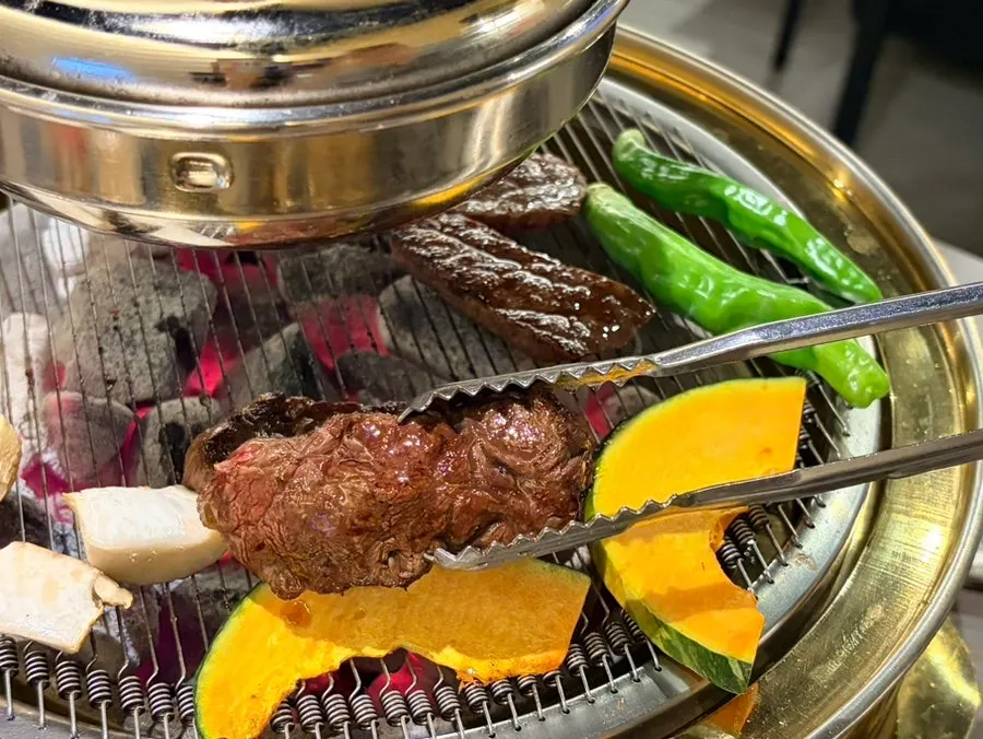 Grilled hanwoo paired with myeong-i namul and scallion shreds