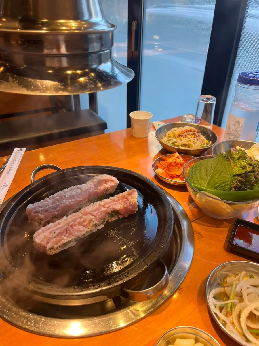 Thick knife-cut pork belly set up by staff
