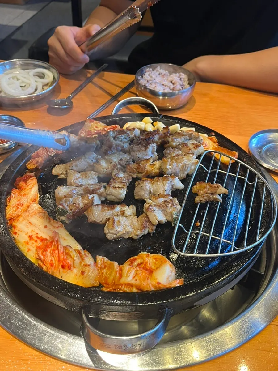 Kimchi grilling at the edge of the pan