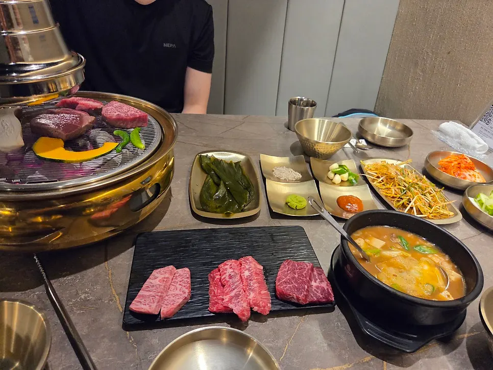 Table set with hanwoo assortment and yukhoe tangtang