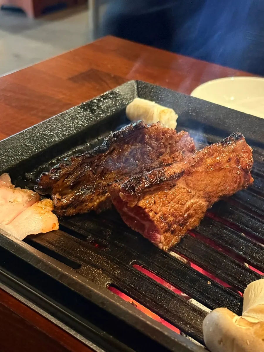 Bracken fern and kimchi on the grill