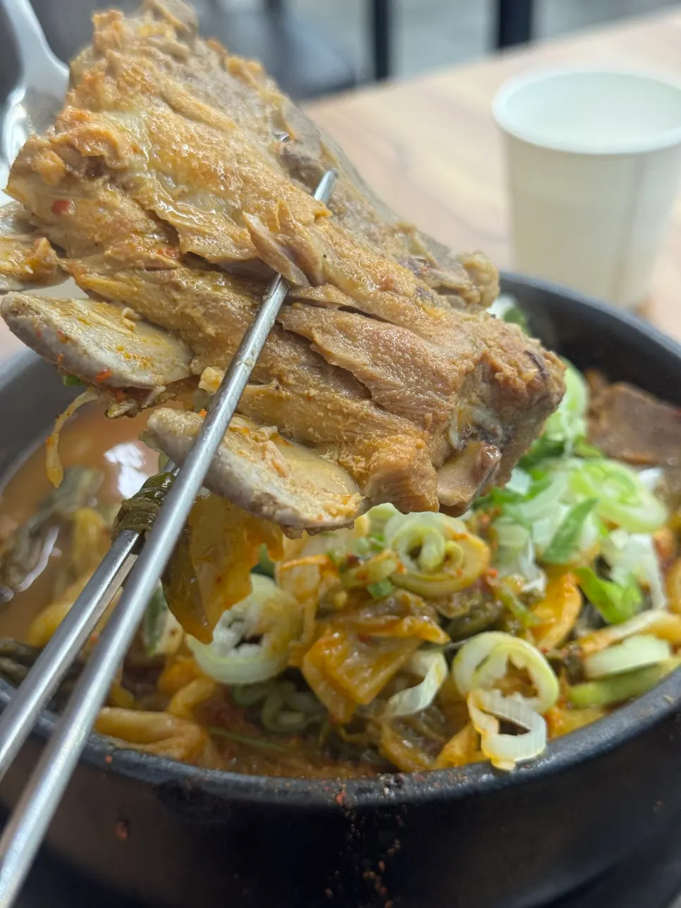 Pork bone soup with meat on the bones