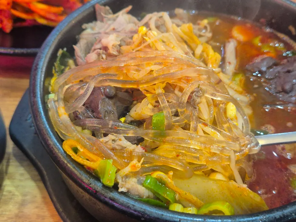 Meat from the haejangguk lifted with a spoon