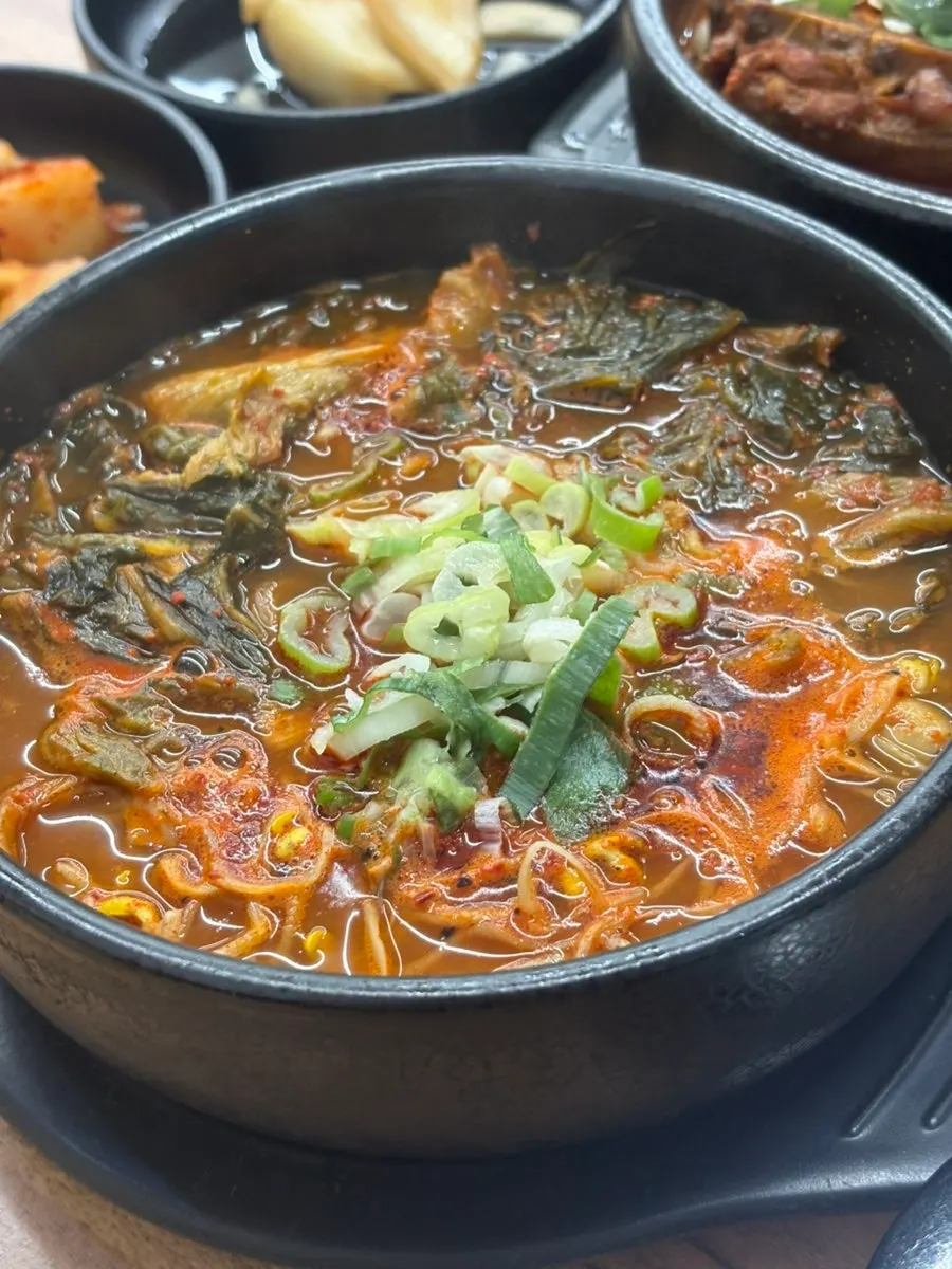 Spicy hangover soup served in an earthenware pot