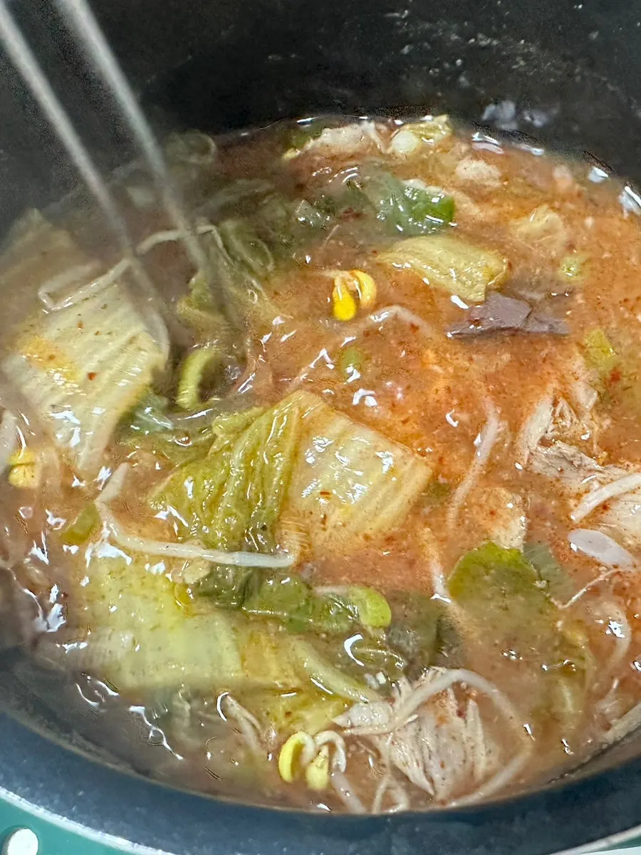 Hangover soup eaten with stirred-in seasoning paste
