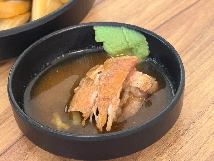 Meat removed from the bone and dipped in mustard sauce