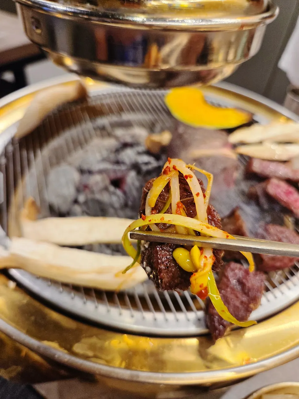 Various hanwoo cuts cooking on the grill