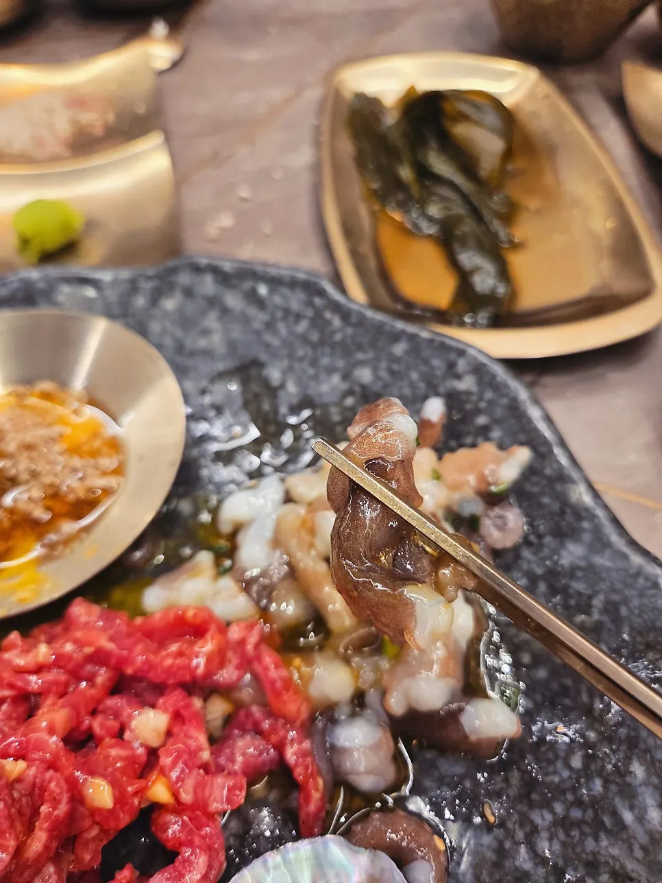 Chopped octopus topping on the yukhoe tangtang