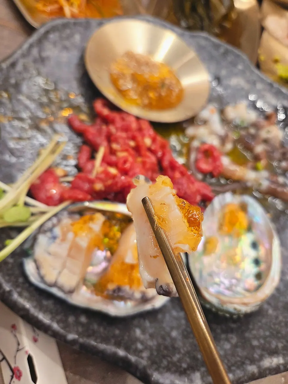 Tender abalone sashimi served with the yukhoe tangtang