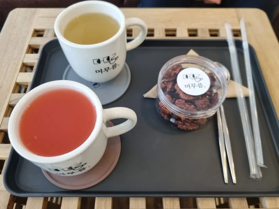 Table setting with grapefruit tea, yuja tea, and handmade walnut jeonggwa