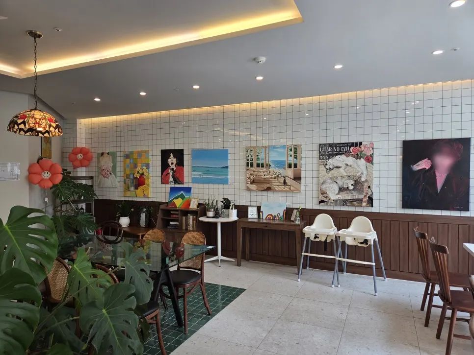 A corner of Café Meomureum with books and a baby chair