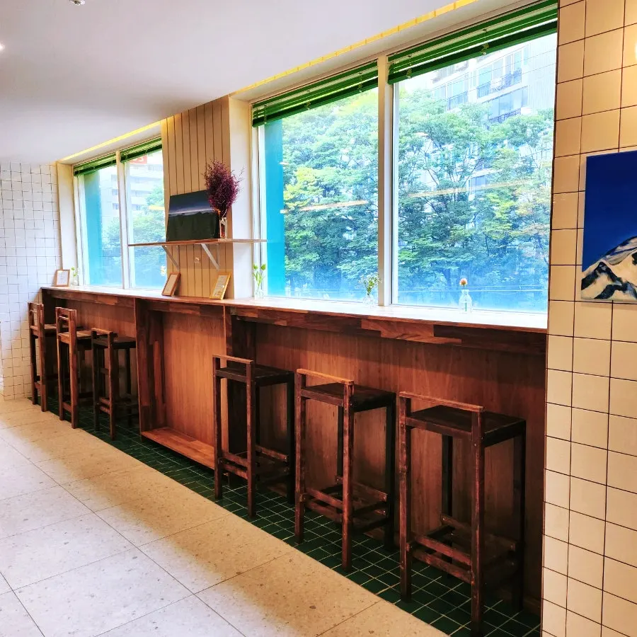 Interior seating at Café Meomureum with paintings on the walls