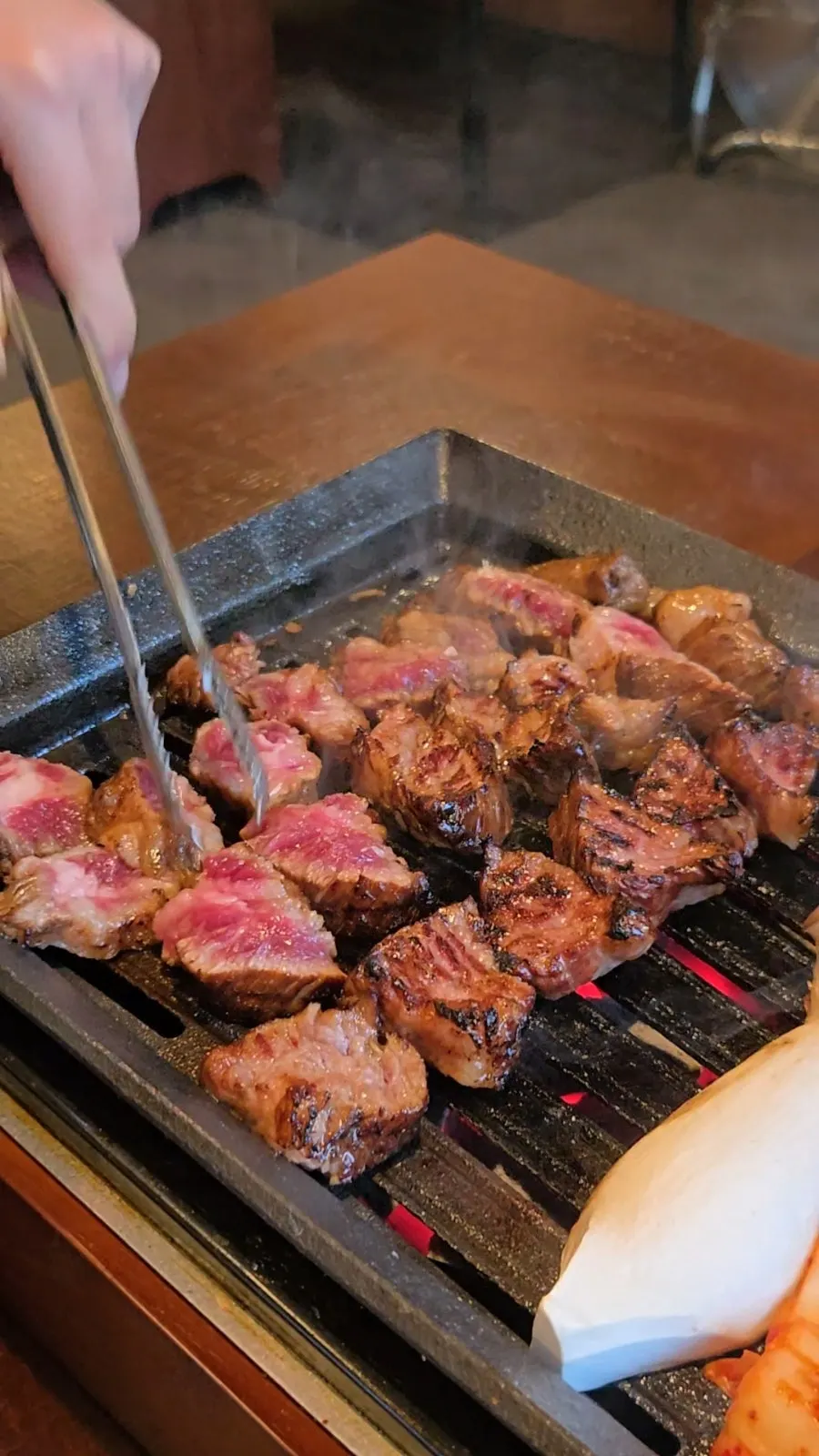 Meat being trimmed from the rib bone